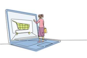 Dibujo continuo de una línea de mujeres jóvenes comprando en línea a través de una pantalla gigante de computadora portátil con carrito de compras en el interior. estilo de vida digital, concepto de consumismo. Ilustración gráfica de vector de diseño de dibujo de una sola línea