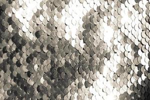 background of silver sequins. shiny sparkling background photo