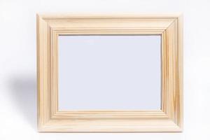 thick wooden frame with empty white space - horizontal frame mockup on white background photo