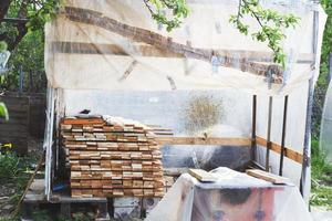 the boards are stacked in the garden photo