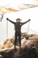 A young traveller trekking on forest trail , Nepal photo