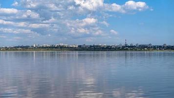 Seascape Sea with calm water and white clouds photo