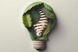 Paper cut of eco friendly light bulb with green leaves, Renewable and sustainable energy concept. photo