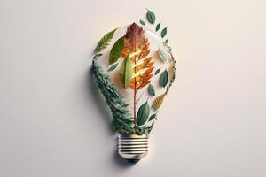 Paper cut of eco friendly light bulb with green leaves, Renewable and sustainable energy concept. photo