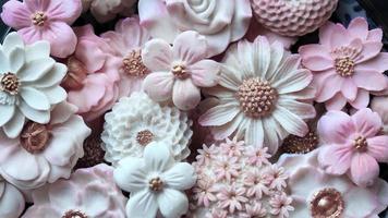 Close up Thai dessert various flower shaped in pastel pink color tone, Coconut milk flavor, Sam Pan Nee traditional Thai handcraft snack, Royal famous Thai sweets, wallpaper photo