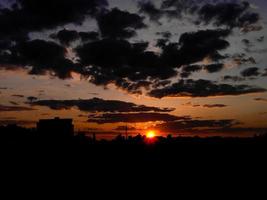 Autumn red sunset with a purple sky photo