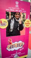 New Delhi, India - March 04 2023 - Unidentified people showing their ink-marked fingers after casting votes in front of polling booth of east Delhi area for MCD local body Elections 2022 photo