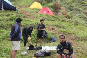 Gorontalo, 5 Feb 2023 - A group of people camping together in nature photo