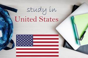 Study in United States. Background with notepad, laptop and backpack. Education concept. photo