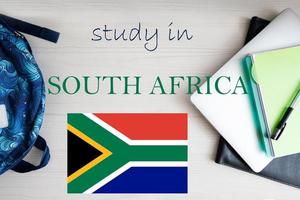 Study in South Africa. Background with notepad, laptop and backpack. Education concept. photo