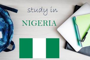 Study in Nigeria. Background with notepad, laptop and backpack. Education concept. photo
