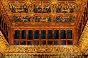 beautiful antique historical golden ceilings background from a palace in spain photo