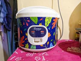 Surabaya, indonesia - april, 2023 - A close up of rice cooker photo