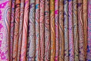 Row of elegant scarves for sale photo