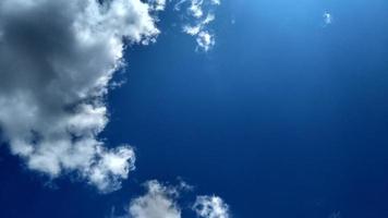 Blue sky with white clouds. Peaceful sky background. Space for text. photo