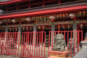 Traditional chinese guardian gate statute on the chinese temples when chinese new years. The photo is suitable to use for chinese new year, lunar new year background and content media.