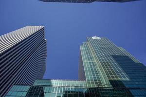 new york manhattan skyscrapers view from the street to the top of the building on sunny clear day photo