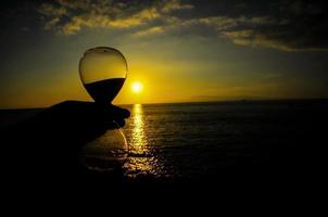 A beautiful sunset view and an hourglass photo