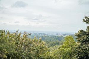 Landscape of hilltop with cloudy vibes when rain season. The photo is suitable to use for environment background, nature poster and nature content media.