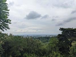 Landscape of hilltop with cloudy vibes when rain season. The photo is suitable to use for environment background, nature poster and nature content media.