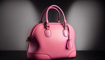 Beautiful trendy smooth youth women's handbag in bright pink color on a gray studio background. Generate Ai. photo