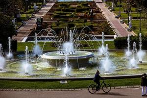 urban landscape of the spanish city of Zaragoza on a warm spring day with fountains in the landmark park photo