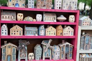 Lots of little toy houses for sale. photo