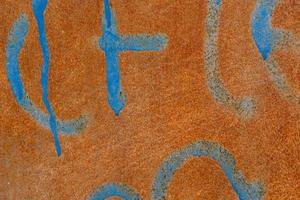 rusty background with blue elements in close-up photo