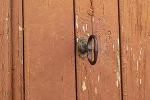 old vintage brown wooden door with metal handle photo