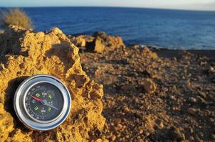 Compass on a rock photo