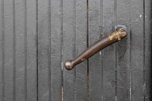 door handle on a background of a gray gate as a background photo