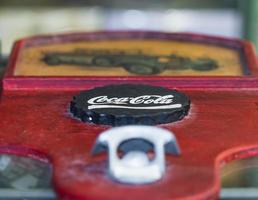 Bottle opener with the logo of Coca Cola photo