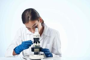 female laboratory assistant work biotechnology analyzes research photo