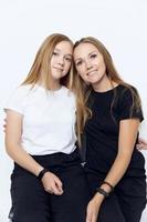 mom and daughter hug friendship studio isolated background photo