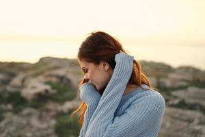 red-haired woman in sweater outdoors travel fresh air photo