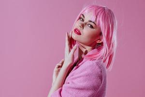 Beautiful fashionable girl attractive look pink wig stylish clothes pink background unaltered photo
