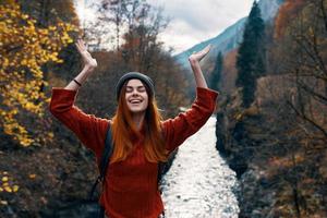 cheerful woman tourist freedom mountains travel river photo