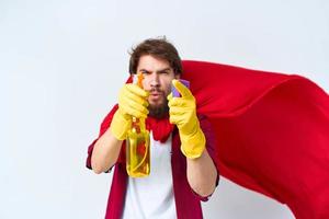 Cheerful male cleaner professional red raincoat housework lifestyle light background photo