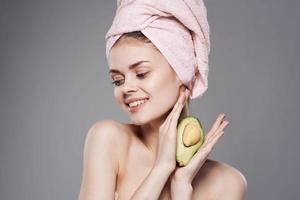 Emotional woman towel on head shower clean skin avocado vitamins natural cosmetics photo