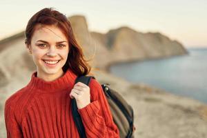 cheerful woman with backpack mountains travel freedom landscape photo