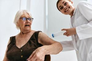 emotional elderly woman big syringe hospital photo