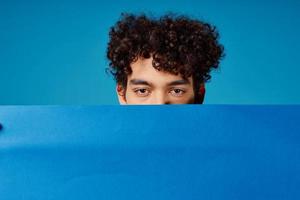 guy with curly hair blue poppy poster advertising photo