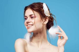 glamorous woman with bare shoulders jewelry cosmetics close-up photo