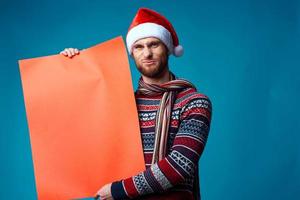 Cheerful man in New Year's clothes advertising copy space studio posing photo