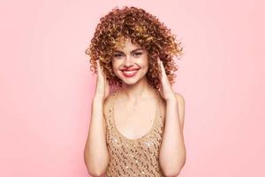 Woman portrait white smile curly hair bright makeup photo