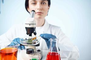 woman laboratory assistant microscope analyzes diagnostics biotechnology photo