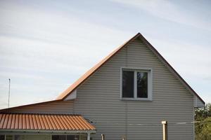 House in village. Window on second floor. Inexpensive house in countryside. photo