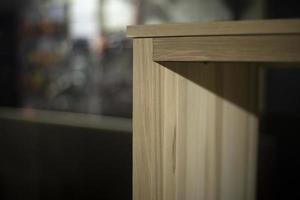 Furniture details. Board in carpentry workshop. Making cabinet from wood. Object is in workshop. photo