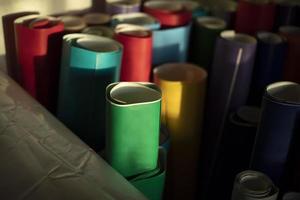Rolls of colored paper. Self-adhesive film in rolls. Creative material. photo
