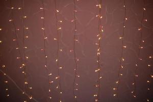 Red garlands. Small light bulbs. LED string lights. photo